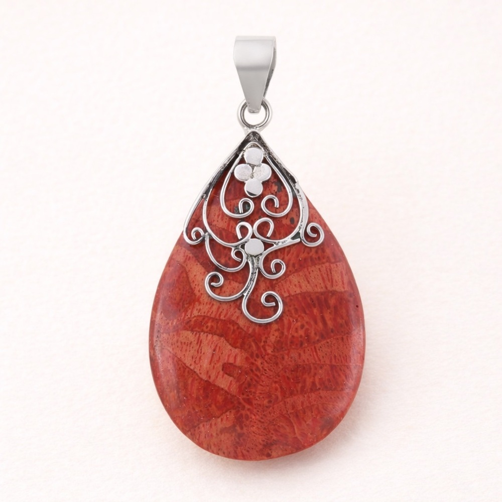 Sponge Coral Solitaire Pendant in Sterling Silver – Scrollwork Drop Design